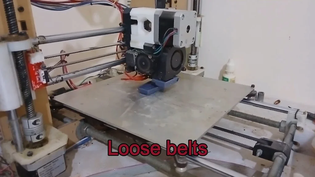 3D printer with loose belts text overlay