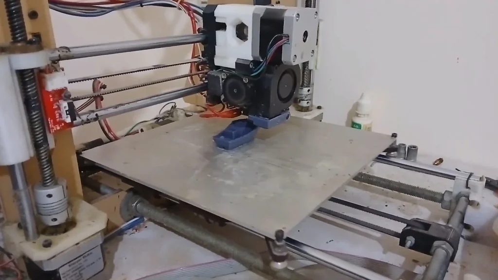 3D printer printing a blue object