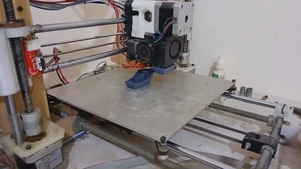 3D printer printing a blue object
