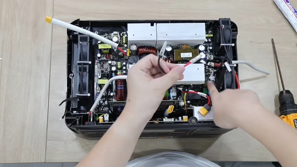 Connecting the red wire to the internal component