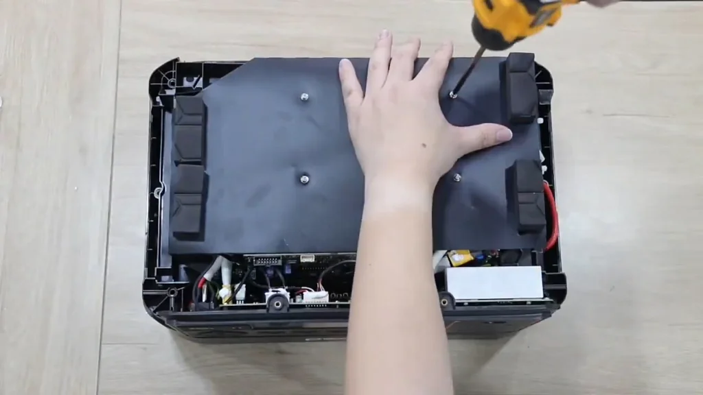 Reinstalling the deflector with an electric screwdriver