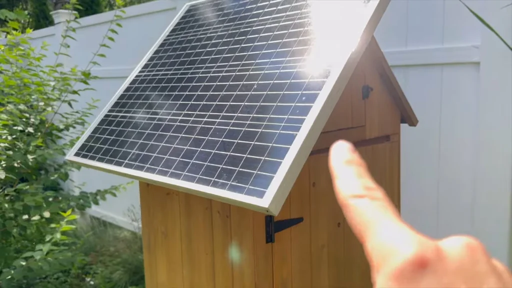 Solar panel installed on a wooden shed roof