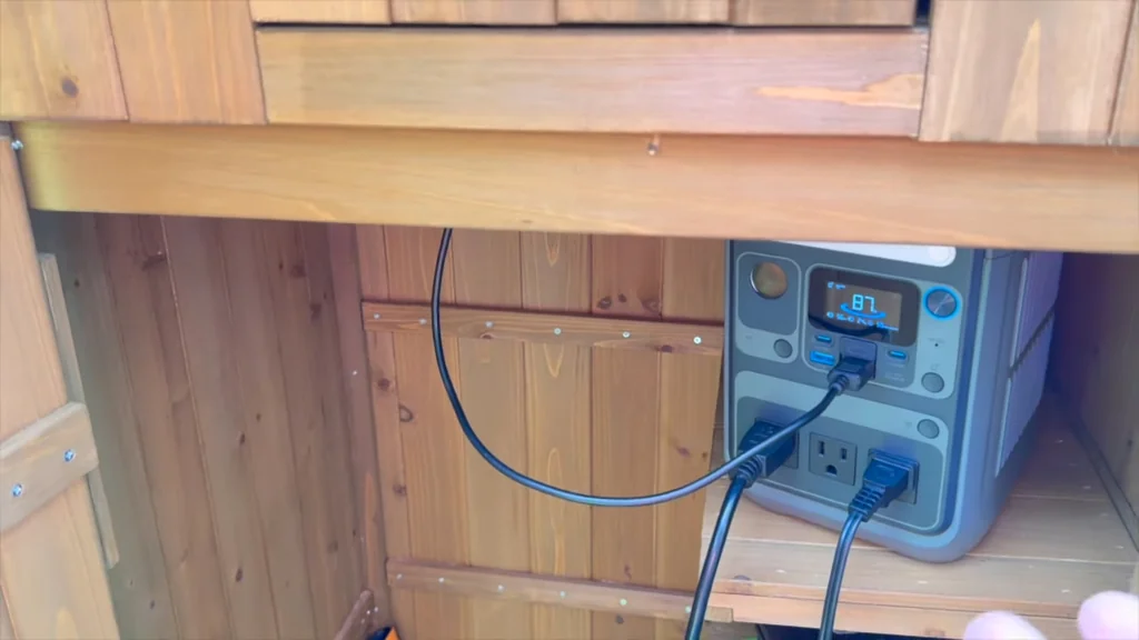 Power station placed on a workbench inside a shed