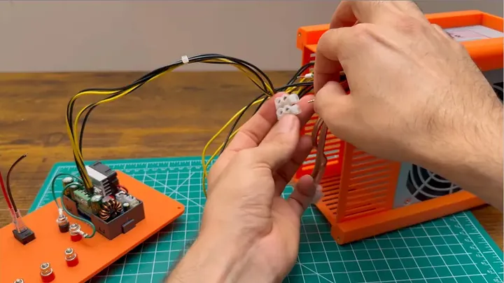 Rear of the printed front panel showing detailed wiring soldered and bolted to terminal posts and the SK120 module