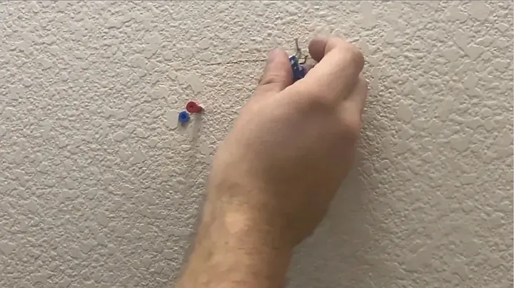 Drywall anchors driven flush into the wall surface at marked mounting positions