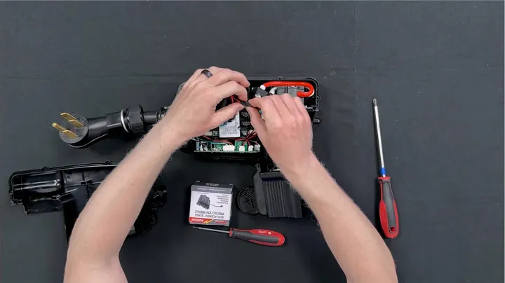Sliding input wires into terminal blocks on new surge protection module