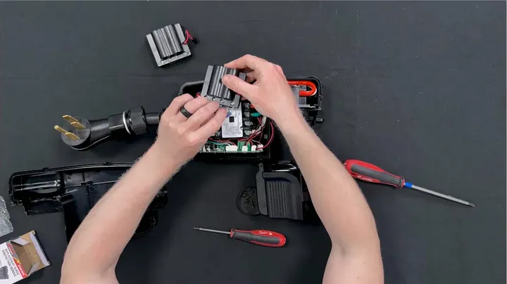 Checking wire color stickers and performing tug test on terminal leads