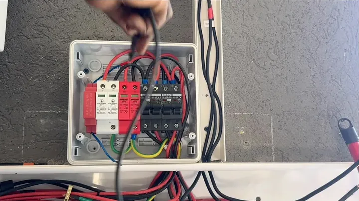 Installing DIN rail automated thermal fire extinguisher tube above circuit breakers