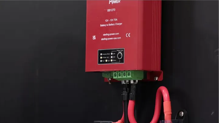 Close-up of the Sterling DC-DC charger unit, showing its terminals and front panel controls.